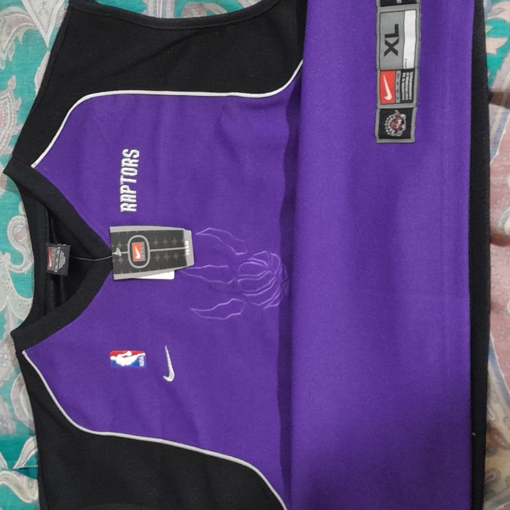 Authentic NBA Raptors Jersey nwt old school purple an black xlarge $45 a piece